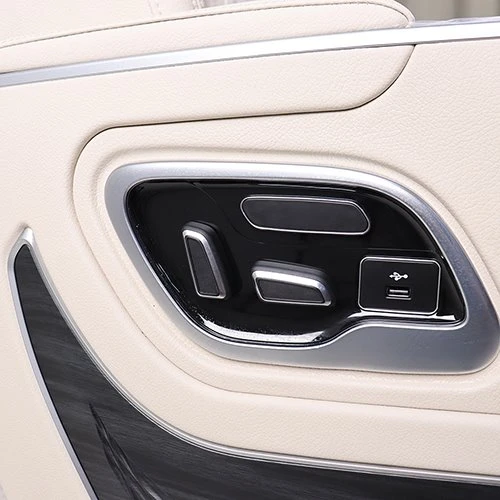 Adjustment buttons on the side panel of the van seat